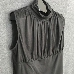 Sleeveless black turtleneck